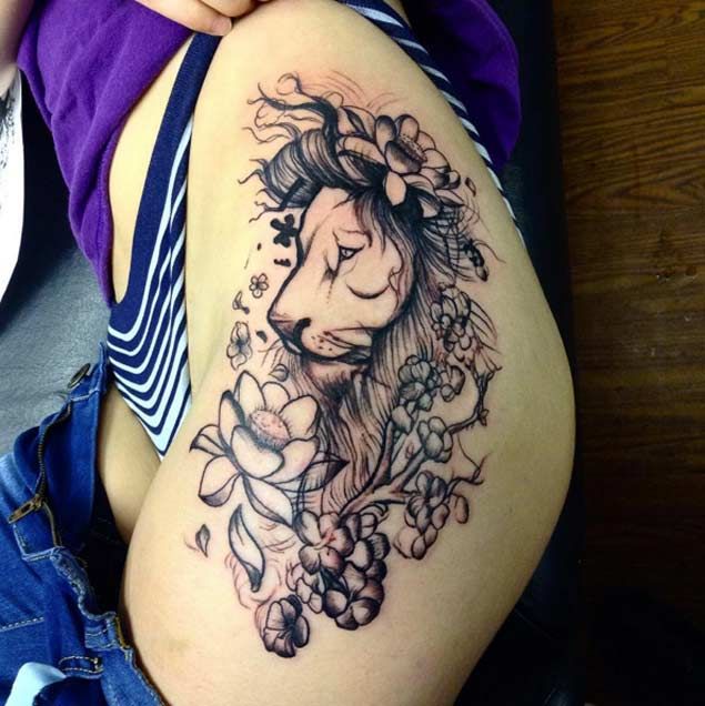 hip lion tattoo.
